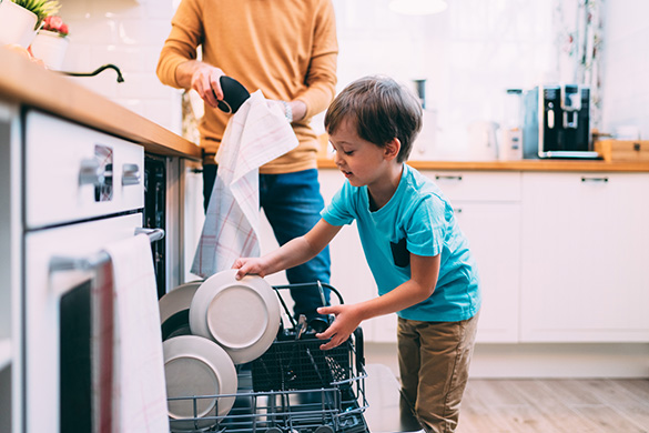 boy-helping-load-dishwasher